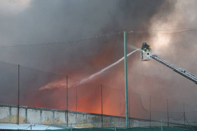 Fire broke out at a shipping company s warehouse in Milan MILAN, ITALY - JULY 8: Firefighters work to extinguish the blaze a fire breaks out at the 8,000-square-meter warehouse of an international shipping company on Don Giovanni Minzoni Street in the Bovisa district of Milan, Italy on July 8, 2026. Civil defense personnel and municipal police established an extensive security perimeter around the warehouse while the cause of the fire has not yet been determined. Michele Luigi Edoardo Novaga Anadolu Milan Italy. Editorial use only. Please get in touch for any other usage.  Copyright: x2026xAnadoluxMichelexLuigixEdoardoxNovagax
