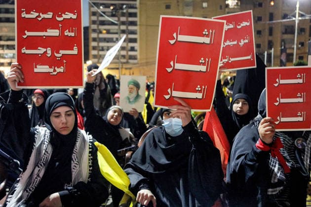 July 8, 2026, Beirut, Beirut, Lebanon: Pro-Iranian Hezbollah supporters raise banners that read: Ã¢â‚¬â ¢RevengeÃ¢â‚¬â ¢Ã¢â‚¬â ¢, and Ã¢â‚¬ËœÃ¢â‚¬â ¢We are scream of Allah-O-Akbar God is great in the face of America,Ã¢â‚¬â ¢Ã¢â‚¬â ¢ during a memorial ceremony mourning the Iranian slain Supreme Leader Ayatollah Ali Khamenei in Beirut southern suburb. Iran began six days of public funeral ceremonies for Khamenei on July 4, including a dedicated day to neighboring Iraq, a Shia powerhouse with close ties to Tehran. Beirut Lebanon - ZUMAn313 20260708_zip_n313_010 Copyright: xMarwanxNaamanix