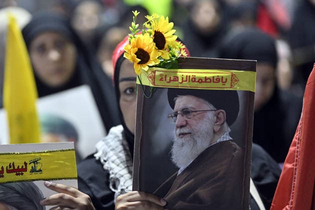 Symbolic funeral ceremony held in Beirut for Iran s late Supreme Leader Khamenei BEIRUT, LEBANON - JULY 8: People, holding photos of Khamenei, Lebanese and Iranian flags, and Hezbollah banners, attend a symbolic funeral ceremony for Iran s late Supreme Leader Ayatollah Ali Khamenei in Dahieh district of Beirut, Lebanon on July 8, 2026. Houssam Shbaro Anadolu Beirut Lebanon. Editorial use only. Please get in touch for any other usage.  Copyright: x2026xAnadoluxHoussamxShbarox
