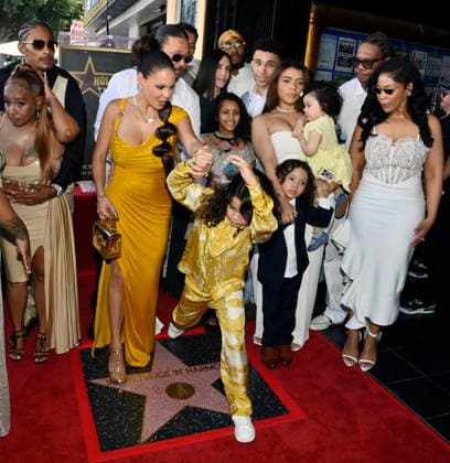 Bizzy Bone (C) of the Hip-Hop group Bone Thugs-N-Harmony is joined by his wife Jessica Cassidy and their son Jessy Anderson and family members during a ceremony honoring them with the 2,851st star on the Hollywood Walk of Fame in Los Angeles on Wednesday, July 8, 2026.  LAP2026070818 JIMxRUYMEN