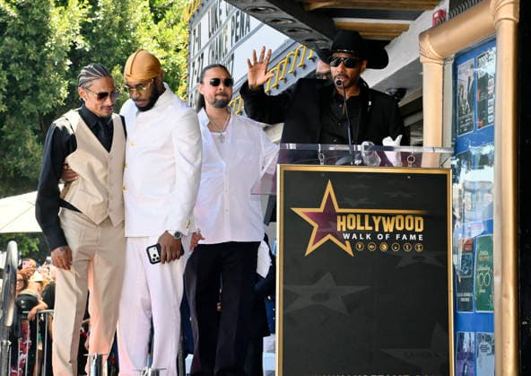 Layzie Bone, Flesh-n-Bone, Bizzy Bone and Krayzie Bone (L-R) of the Hip-Hop group Bone Thugs-N-Harmony gather around their star during a ceremony honoring them with the 2,851st star on the Hollywood Walk of Fame in Los Angeles on Wednesday, July 8, 2026.  LAP2026070814 JIMxRUYMEN