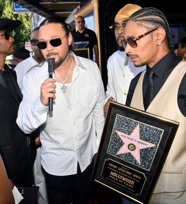 Bizzy Bone (L) and Layzie Bone of the Hip-Hop group Bone Thugs-N-Harmony speak with reporters during a ceremony honoring them with the 2,851st star on the Hollywood Walk of Fame in Los Angeles on Wednesday, July 8, 2026.  LAP2026070824 JIMxRUYMEN