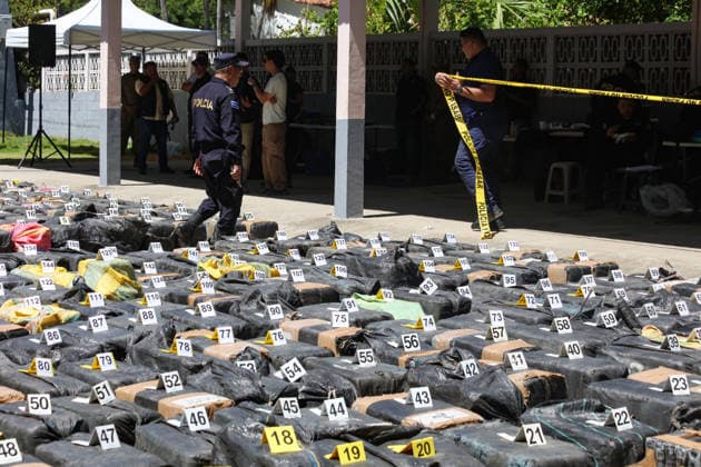 Salvadoran Security Authorities Present Seized Drug Shipment LA PAZ, EL SALVADOR - JULY 08: Police officers guarding drug packages marked as evidence during the presentation of a drug shipment seized at sea by Salvadoran security authorities, at the Port Captaincy of La Concordia on the Costa del Sol, La Paz, El Salvador on July 08, 2026. Salvadoran President Nayib Bukele reported on his social media that on June 18, members of the Salvadoran National Navy seized 6.68 tons of drugs more than 600 nautical miles offshore, valued at $167 million. Alex Pena Anadolu La Paz El Salvador. Editorial use only. Please get in touch for any other usage.  Copyright: x2026xAnadoluxAlexxPenax