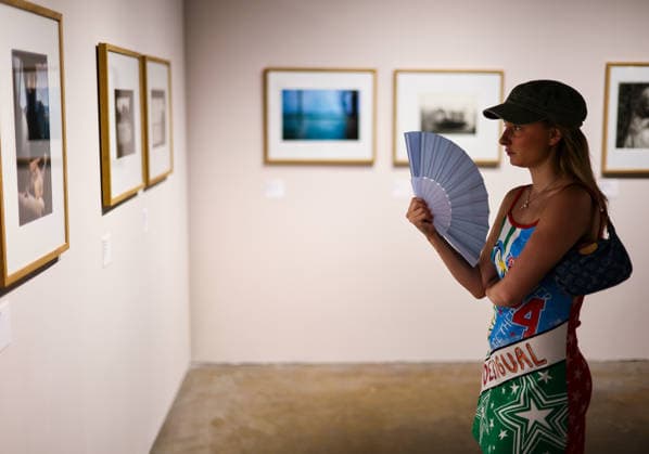 (260709) -- ARLES, July 9, 2026 -- A woman views exhibits during an exhibition at the Rencontres d Arles photography festival in Arles, France, July 8, 2026. The 57th Rencontres d Arles photography festival lasts from July 6 to October 4. ) FRANCE-ARLES-RENCONTRES D ARLES-PHOTOGRAPHY FESTIVAL-EXHIBITION WuxHuiwo 