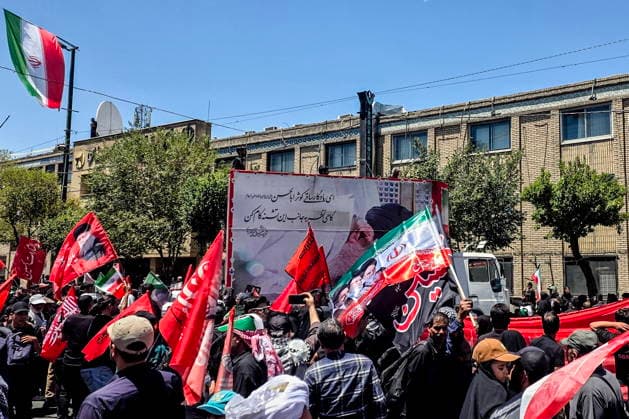 IRAN, MASHHAD - JULY 9, 2026: People gather outside a mausoleum ahead of the burial of Iranian Supreme Leader Ayatollah Ali Khamenei. Khamenei was killed in a joint US-Israeli airstrike on February 28. Mark Kiselev TASS  94850584