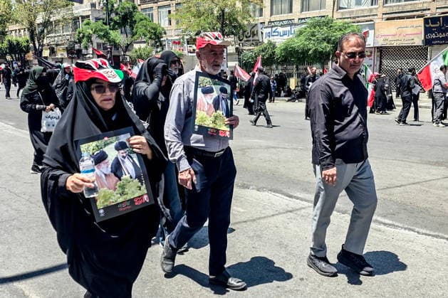 IRAN, MASHHAD - JULY 9, 2026: People gather outside a mausoleum ahead of the burial of Iranian Supreme Leader Ayatollah Ali Khamenei. Khamenei was killed in a joint US-Israeli airstrike on February 28 Mashhad Iran  - ZUMAt113 20260709_zaa_t113_073 Copyright: xMarkxKiselevx