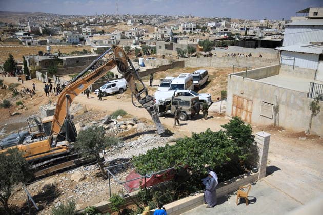 Israeli forces demolish home in southern West Bank town of Yatta Israeli forces demolish the two-story home of Palestinian resident Iyad Musleh al-Amour in the Khallet al-Miyeh area, east of the town of Yatta, south of Hebron in the occupied West Bank, on July 9, 2026. The house was home to three families comprising 15 people. According to local residents, the demolition was carried out on the grounds that the building lacked a permit, leaving the families displaced. Photo by Mamoun Wazwaz apaimages Hebron West Bank Palestinian Territory 090726_Hebron_MW_00(46) Copyright: xapaimagesxMamounxWazwazx xapaimagesx