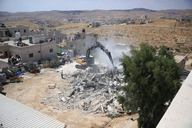 Israeli forces demolish home in southern West Bank town of Yatta Israeli forces demolish the two-story home of Palestinian resident Iyad Musleh al-Amour in the Khallet al-Miyeh area, east of the town of Yatta, south of Hebron in the occupied West Bank, on July 9, 2026. The house was home to three families comprising 15 people. According to local residents, the demolition was carried out on the grounds that the building lacked a permit, leaving the families displaced. Photo by Mamoun Wazwaz apaimages Hebron West Bank Palestinian Territory 090726_Hebron_MW_00(44) Copyright: xapaimagesxMamounxWazwazx xapaimagesx