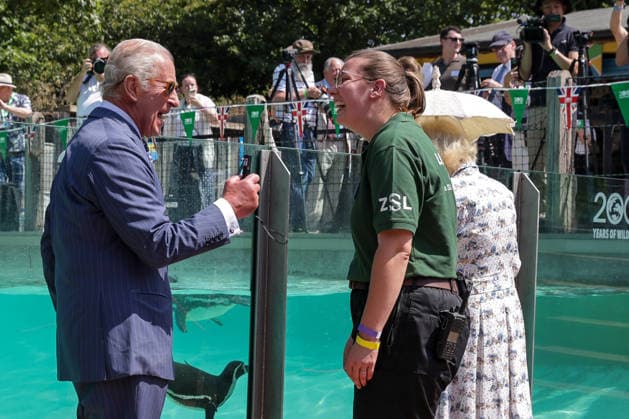 July 9, 2026, London, London, UK: London, UK. King Charles III jokes with the zookeeper while holding a laser pointer used to attract Humboldt penguins at Penguin Beach during a visit to London Zoo marking the 200th anniversary of the Zoological Society of London. London UK  - ZUMAl94_ 20260709_zaf_l94_019 Copyright: xDinendraxHariax