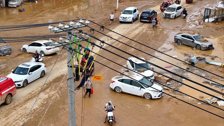 (260709) -- NANNING, July 9, 2026 -- A drone photo shows a power worker restoring electricity in Yunbiao Town of Hengzhou City, south China s Guangxi Zhuang Autonomous Region, July 9, 2026. Recent extreme rainstorms triggered by Typhoon Maysak, the 10th typhoon of the year, have caused severe flooding in parts of Guangxi in the Pearl River basin. Guangxi is continuing its search and rescue operations for missing persons, enhancing resettlement services for affected residents and advancing post-disaster reconstruction. ) FOCUS Guangxi makes all-out rescue, relief efforts after rain-triggered disasters HuangxXiaobang 