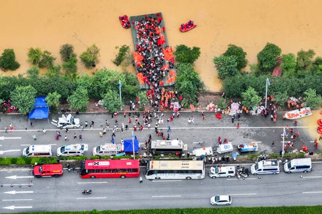 (260709) -- NANNING, July 9, 2026 -- An aerial drone photo shows rescuers evacuating trapped students in Guigang City, south China s Guangxi Zhuang Autonomous Region, July 9, 2026. Recent extreme rainstorms triggered by Typhoon Maysak, the 10th typhoon of the year, have caused severe flooding in parts of Guangxi in the Pearl River basin. Guangxi is continuing its search and rescue operations for missing persons, enhancing resettlement services for affected residents and advancing post-disaster reconstruction. ) FOCUS Guangxi makes all-out rescue, relief efforts after rain-triggered disasters ZhouxHua 
