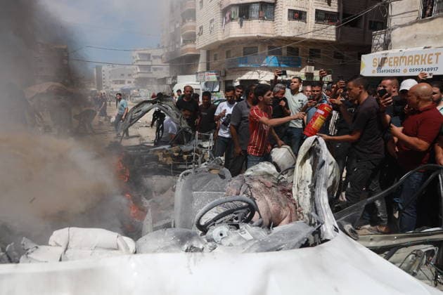 Palestinians gather at site of Israeli strike in western Gaza City Palestinians gather at the site of an Israeli strike that targeted a vehicle west of Gaza City, Gaza Strip, on July 9, 2026. According to local sources, the strike killed one person and wounded others. Photo by Hadi Daoud apaimages Gaza city Gaza Strip Palestinian Territory 090726_Gaza_HD_01(6) Copyright: xapaimagesxHadixDaoudx xapaimagesx