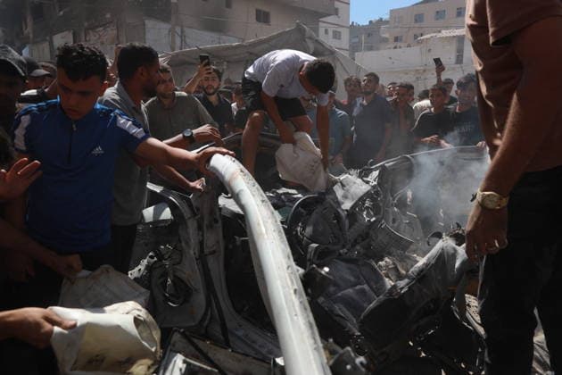 Palestinians gather at site of Israeli strike in western Gaza City Palestinians gather at the site of an Israeli strike that targeted a vehicle west of Gaza City, Gaza Strip, on July 9, 2026. According to local sources, the strike killed one person and wounded others. Photo by Hadi Daoud apaimages Gaza city Gaza Strip Palestinian Territory 090726_Gaza_HD_01(13) Copyright: xapaimagesxHadixDaoudx xapaimagesx