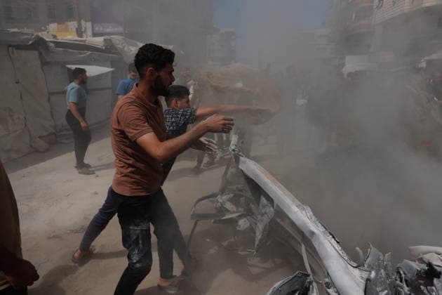 Palestinians gather at site of Israeli strike in western Gaza City Palestinians gather at the site of an Israeli strike that targeted a vehicle west of Gaza City, Gaza Strip, on July 9, 2026. According to local sources, the strike killed one person and wounded others. Photo by Hadi Daoud apaimages Gaza city Gaza Strip Palestinian Territory 090726_Gaza_HD_01(8) Copyright: xapaimagesxHadixDaoudx xapaimagesx