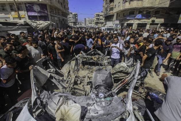 RECORD DATE NOT STATED One Killed, Three Injured After Airstrike Hits Vehicle in Western Gaza City (INT) One Killed, Three Injured After Airstrike Hits Vehicle in Western Gaza City. July 9, 2026, Gaza, Palestine: Palestinians inspect a civilian vehicle after it was struck in an airstrike at Haidar Roundabout, west of Gaza City. According to medical sources, one person was killed and three others were injured in the strike. The casualties were transferred to Al-Shifa Medical Complex as emergency teams responded to the scene. Credit: Hashem Zimmo TheNews2(Foto: Hashem Zimmo Thenews2 imago images) One Killed, Three Injured After Airstrike Hits Vehicle in Western Gaza City  Copyright: xHashemxZimmox