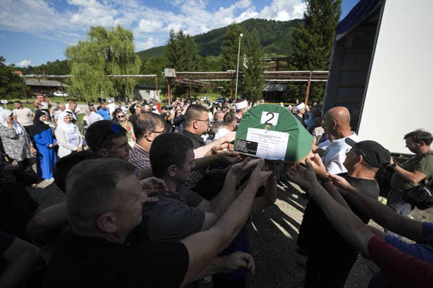 Column with the coffins of ten victims of the Srebrenica genocide has arrived in Potocari POTOCARI, BOSNIA AND HERZEGOVINA - JULY 09: People carry coffins containing the remains of victims of the 1995 Srebrenica genocide upon their arrival at the Memorial Center as family members and friends gather at the former Battery Factory to pay their respects to those who will be laid to rest during a collective funeral on July 11 in Potocari, Bosnia and Herzegovina, on July 09, 2026. Samir Jordamovic Anadolu Potocari Bosnia and Herzegovina. Editorial use only. Please get in touch for any other usage.  Copyright: x2026xAnadoluxSamirxJordamovicx