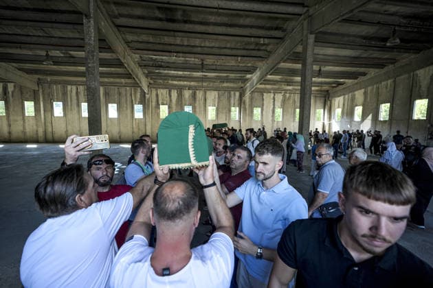 Column with the coffins of ten victims of the Srebrenica genocide has arrived in Potocari POTOCARI, BOSNIA AND HERZEGOVINA - JULY 09: People carry coffins containing the remains of victims of the 1995 Srebrenica genocide upon their arrival at the Memorial Center as family members and friends gather at the former Battery Factory to pay their respects to those who will be laid to rest during a collective funeral on July 11 in Potocari, Bosnia and Herzegovina, on July 09, 2026. Samir Jordamovic Anadolu Potocari Bosnia and Herzegovina. Editorial use only. Please get in touch for any other usage.  Copyright: x2026xAnadoluxSamirxJordamovicx