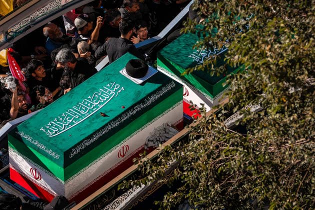 July 9, 2026, Mashhad, Razavi Khorasan, Iran: Crowds of mourners surround the convoy carrying the coffins of Iran s slain supreme leader Ali Khamenei and members of his family during a funeral procession, before he is buried at the Shrine of Imam Reza, Iran s most revered place of worship, in Mashhad on July 9, 2026. Braving sweltering heat and calling for revenge, Iranians loyal to the Islamic Republic massed on July 9 for the burial of slain supreme leader Ali Khamenei in his hometown of Mashhad. Khamenei will be buried in his hometown of Mashhad, home to the shrine of Imam Reza, Iran s holiest Shia Muslim site, following several days of ceremonies and processions across the country. Mashhad Iran - ZUMAi98_ 20260709_zih_i98_021 Copyright: xIranianxSupremexLeader SxOfficex
