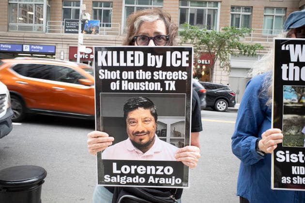July 9, 2026, New York, New York, USA: A protester holds a sign that reads KILLED by ICE Lorenzo Salgado Araujo with his picture at Rise and Resist s weekly vigil for those impacted by President Trump s immigrant detention and mass deportation policies, held outside the immigration courts, Department of Homeland Security and ICE offices at 26 Federal Plaza in Lower Manhattan. The demonstration takes place days after the death of L. Salgado Araujo who was shot and killed by U.S. Immigration and Customs Enforcement (ICE) in Houston during a targeted enforcement operation. New York USA  - ZUMAr174 20260709_znp_r174_001 Copyright: xGinaxMxRandazzox