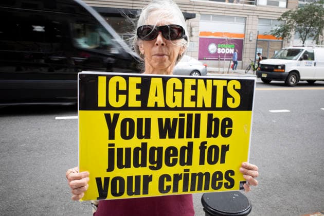 July 9, 2026, New York, New York, USA: A protester holds a sign that reads ICE AGENTS You will be judged for your crimes at Rise and Resist s weekly vigil for those impacted by President Trump s immigrant detention and mass deportation policies, held outside the immigration courts, Department of Homeland Security and ICE offices at 26 Federal Plaza in Lower Manhattan. The demonstration takes place days after the death of L. Salgado Araujo who was shot and killed by U.S. Immigration and Customs Enforcement (ICE) in Houston during a targeted enforcement operation. New York USA  - ZUMAr174 20260709_znp_r174_009 Copyright: xGinaxMxRandazzox