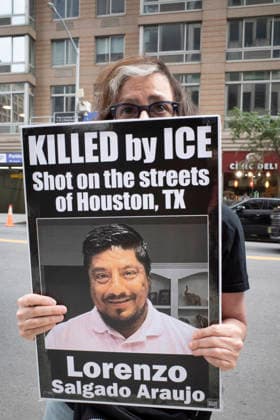 July 9, 2026, New York, New York, USA: A protester holds a sign that reads KILLED by ICE Shot on the streets of Houston, TX Lorenzo Salgado Araujo with his picture at Rise and Resist s weekly vigil for those impacted by President Trump s immigrant detention and mass deportation policies, held outside the immigration courts, Department of Homeland Security and ICE offices at 26 Federal Plaza in Lower Manhattan. The demonstration takes place days after the death of L. Salgado Araujo who was shot and killed by U.S. Immigration and Customs Enforcement (ICE) in Houston during a targeted enforcement operation. New York USA  - ZUMAr174 20260709_znp_r174_019 Copyright: xGinaxMxRandazzox
