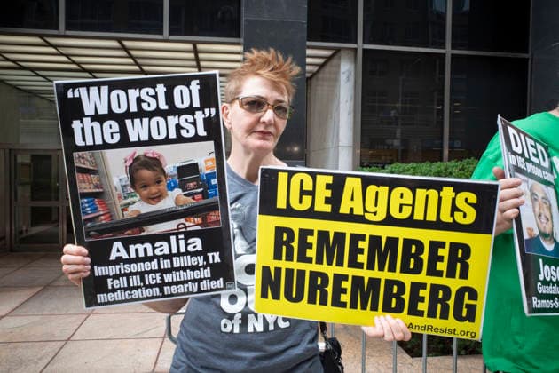 July 9, 2026, New York, New York, USA: A protester holds signs that read Worst of the worst Amalia Imprisoned in Dilley, TX Fell ill, ICE withheld medicaiton nearly died with her picture ICE Agents REMEMBER NUREMBERG at Rise and Resist s weekly vigil for those impacted by President Trump s immigrant detention and mass deportation policies, held outside the immigration courts, Department of Homeland Security and ICE offices at 26 Federal Plaza in Lower Manhattan. The demonstration takes place days after the death of L. Salgado Araujo who was shot and killed by U.S. Immigration and Customs Enforcement (ICE) in Houston during a targeted enforcement operation. New York USA  - ZUMAr174 20260709_znp_r174_020 Copyright: xGinaxMxRandazzox