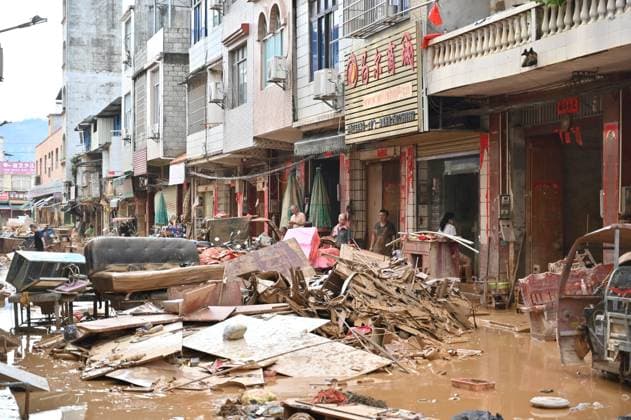 GUIGANG, CHINA - JULY 09: Residents clear silt and debris after floodwater recedes on July 9, 2026 in Guigang, Guangxi Zhuang Autonomous Region of China. Recent extreme rainstorms triggered by Typhoon Maysak, the 10th typhoon of the year, have caused severe flooding in parts of Guangxi in the Pearl River basin. Guangxi is continuing its search and rescue operations for missing persons, enhancing resettlement services for affected residents and advancing post-disaster reconstruction.  Copyright: xChinaxNewsxServicex 111653305444