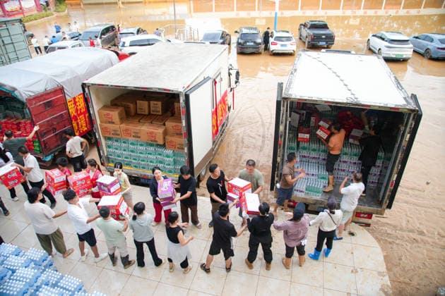 GUIGANG, CHINA - JULY 09: Rescue workers transport relief supplies at a temporary command center set up at a junior high school on July 9, 2026 in Guigang, Guangxi Zhuang Autonomous Region of China. Recent extreme rainstorms triggered by Typhoon Maysak, the 10th typhoon of the year, have caused severe flooding in parts of Guangxi in the Pearl River basin. Guangxi is continuing its search and rescue operations for missing persons, enhancing resettlement services for affected residents and advancing post-disaster reconstruction.  Copyright: xChinaxNewsxServicex 111653326817