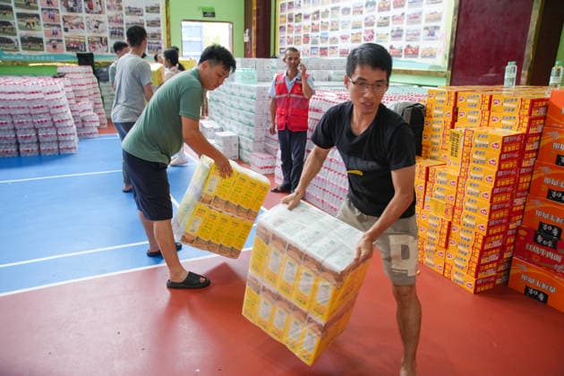 GUIGANG, CHINA - JULY 09: Relief workers transport disaster relief supplies at an evacuation center set up at a junior high school on July 9, 2026 in Guigang, Guangxi Zhuang Autonomous Region of China. Recent extreme rainstorms triggered by Typhoon Maysak, the 10th typhoon of the year, have caused severe flooding in parts of Guangxi in the Pearl River basin. Guangxi is continuing its search and rescue operations for missing persons, enhancing resettlement services for affected residents and advancing post-disaster reconstruction.  Copyright: xChinaxNewsxServicex 111653326839