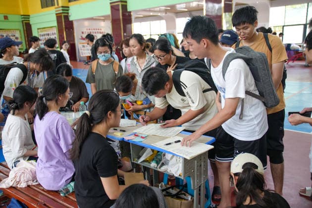 GUIGANG, CHINA - JULY 09: Students sign in upon arrival at a relief shelter set up at a junior high school on July 9, 2026 in Guigang, Guangxi Zhuang Autonomous Region of China. Recent extreme rainstorms triggered by Typhoon Maysak, the 10th typhoon of the year, have caused severe flooding in parts of Guangxi in the Pearl River basin. Guangxi is continuing its search and rescue operations for missing persons, enhancing resettlement services for affected residents and advancing post-disaster reconstruction.  Copyright: xChinaxNewsxServicex 111653326847
