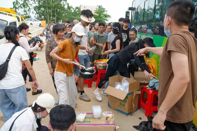 GUIGANG, CHINA - JULY 09: Residents queue to receive meals on July 9, 2026 in Guigang, Guangxi Zhuang Autonomous Region of China. Recent extreme rainstorms triggered by Typhoon Maysak, the 10th typhoon of the year, have caused severe flooding in parts of Guangxi in the Pearl River basin. Guangxi is continuing its search and rescue operations for missing persons, enhancing resettlement services for affected residents and advancing post-disaster reconstruction.  Copyright: xChinaxNewsxServicex 111653326855