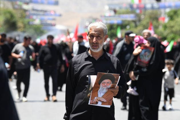 (260710) -- MASHHAD, July 10, 2026 -- People attend the funeral procession of Iran s late Supreme Leader Ali Khamenei in Mashhad, Iran, July 9, 2026. Ali Khamenei was laid to rest in the northeastern Iranian city of Mashhad on Thursday. Shadati) IRAN-MASHHAD-LATE SUPREME LEADER-ALI KHAMENEI-MOURNING ShaxDati 