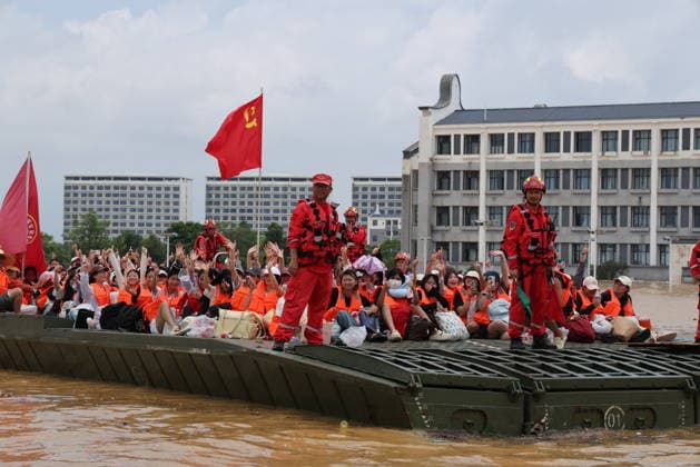 GUIGANG, CHINA - JULY 09: Rescuers evacuate trapped students on July 9, 2026 in Guigang, Guangxi Zhuang Autonomous Region of China. Recent extreme rainstorms triggered by Typhoon Maysak, the 10th typhoon of the year, have caused severe flooding in parts of Guangxi in the Pearl River basin. Guangxi is continuing its search and rescue operations for missing persons, enhancing resettlement services for affected residents and advancing post-disaster reconstruction.  Copyright: xVCGx 111653352918