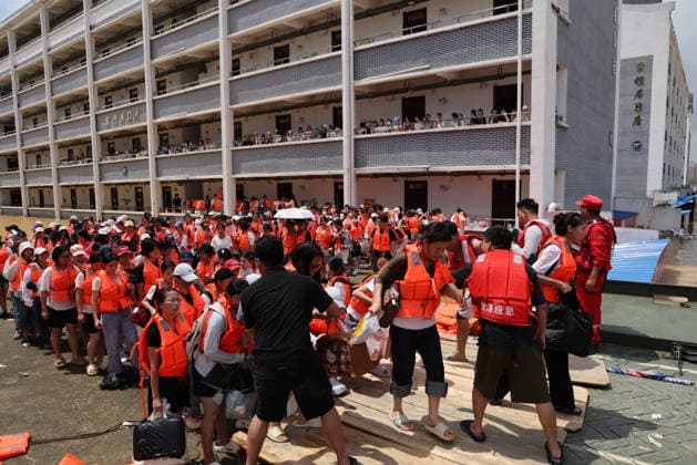 GUIGANG, CHINA - JULY 09: Rescuers evacuate trapped students on July 9, 2026 in Guigang, Guangxi Zhuang Autonomous Region of China. Recent extreme rainstorms triggered by Typhoon Maysak, the 10th typhoon of the year, have caused severe flooding in parts of Guangxi in the Pearl River basin. Guangxi is continuing its search and rescue operations for missing persons, enhancing resettlement services for affected residents and advancing post-disaster reconstruction.  Copyright: xVCGx 111653352914