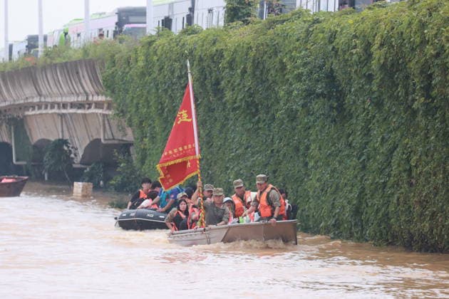 GUIGANG, CHINA - JULY 09: Rescuers evacuate trapped students on July 9, 2026 in Guigang, Guangxi Zhuang Autonomous Region of China. Recent extreme rainstorms triggered by Typhoon Maysak, the 10th typhoon of the year, have caused severe flooding in parts of Guangxi in the Pearl River basin. Guangxi is continuing its search and rescue operations for missing persons, enhancing resettlement services for affected residents and advancing post-disaster reconstruction.  Copyright: xVCGx 111653352904