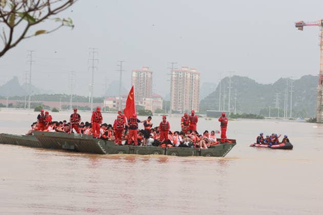 GUIGANG, CHINA - JULY 09: Rescuers evacuate trapped students on July 9, 2026 in Guigang, Guangxi Zhuang Autonomous Region of China. Recent extreme rainstorms triggered by Typhoon Maysak, the 10th typhoon of the year, have caused severe flooding in parts of Guangxi in the Pearl River basin. Guangxi is continuing its search and rescue operations for missing persons, enhancing resettlement services for affected residents and advancing post-disaster reconstruction.  Copyright: xVCGx 111653352905