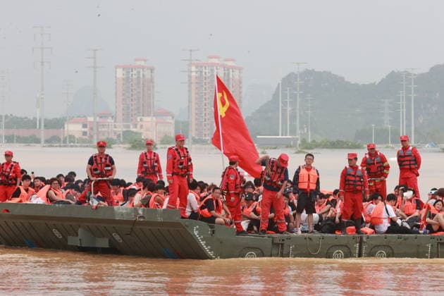 GUIGANG, CHINA - JULY 09: Rescuers evacuate trapped students on July 9, 2026 in Guigang, Guangxi Zhuang Autonomous Region of China. Recent extreme rainstorms triggered by Typhoon Maysak, the 10th typhoon of the year, have caused severe flooding in parts of Guangxi in the Pearl River basin. Guangxi is continuing its search and rescue operations for missing persons, enhancing resettlement services for affected residents and advancing post-disaster reconstruction.  Copyright: xVCGx 111653352906