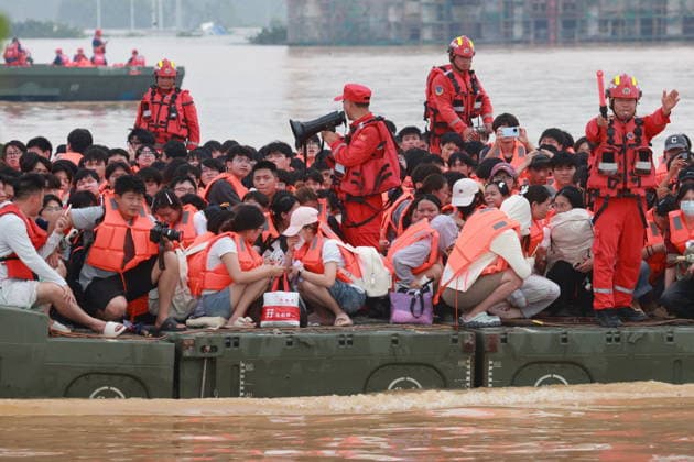 GUIGANG, CHINA - JULY 09: Rescuers evacuate trapped students on July 9, 2026 in Guigang, Guangxi Zhuang Autonomous Region of China. Recent extreme rainstorms triggered by Typhoon Maysak, the 10th typhoon of the year, have caused severe flooding in parts of Guangxi in the Pearl River basin. Guangxi is continuing its search and rescue operations for missing persons, enhancing resettlement services for affected residents and advancing post-disaster reconstruction.  Copyright: xVCGx 111653352909