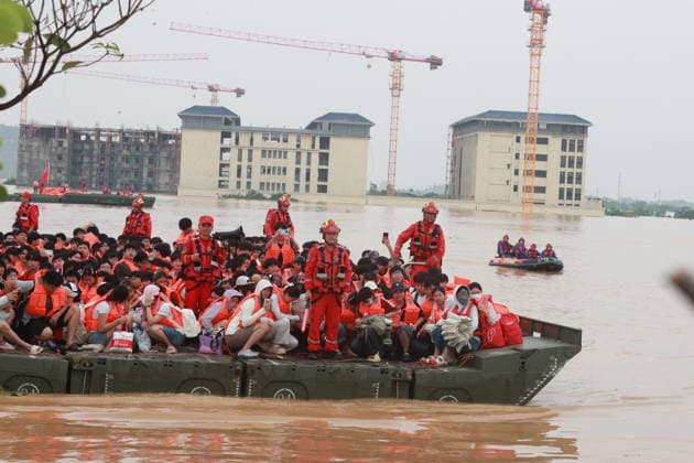 GUIGANG, CHINA - JULY 09: Rescuers evacuate trapped students on July 9, 2026 in Guigang, Guangxi Zhuang Autonomous Region of China. Recent extreme rainstorms triggered by Typhoon Maysak, the 10th typhoon of the year, have caused severe flooding in parts of Guangxi in the Pearl River basin. Guangxi is continuing its search and rescue operations for missing persons, enhancing resettlement services for affected residents and advancing post-disaster reconstruction.  Copyright: xVCGx 111653352910