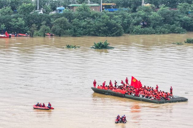 (260710) -- BEIJING, July 10, 2026 -- An aerial drone photo shows rescuers evacuating trapped students in Guigang City, south China s Guangxi Zhuang Autonomous Region, July 9, 2026. Recent extreme rainstorms triggered by Typhoon Maysak, the 10th typhoon of the year, have caused severe flooding in parts of Guangxi in the Pearl River basin. Guangxi is continuing its search and rescue operations for missing persons, enhancing resettlement services for affected residents and advancing post-disaster reconstruction. ) XINHUA PHOTOS OF THE DAY CaoxYiming 