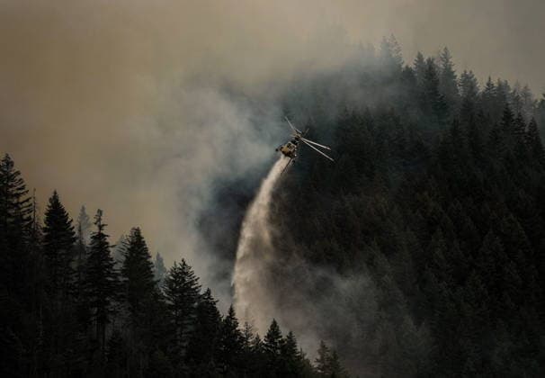 July 9, 2026, Boston Bar, Bc, CANADA: A helicopter drops water while fighting the Brunswick Creek wildfire in Boston Bar, B.C., on Thursday, July 9, 2026. Boston Bar CANADA  - ZUMAc35_ 20260709_zaf_c35_069 Copyright: xDarrylxDyckx