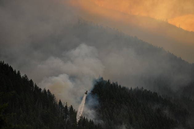 July 9, 2026, Boston Bar, Bc, CANADA: A helicopter drops water while fighting the Brunswick Creek wildfire in Boston Bar, B.C., on Thursday, July 9, 2026. Boston Bar CANADA  - ZUMAc35_ 20260709_zaf_c35_071 Copyright: xDarrylxDyckx
