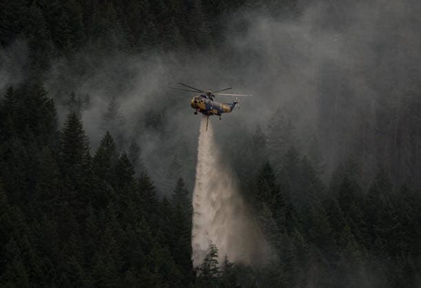 July 9, 2026, Boston Bar, Bc, CANADA: A helicopter drops water while fighting the Brunswick Creek wildfire in Boston Bar, B.C., on Thursday, July 9, 2026. Boston Bar CANADA  - ZUMAc35_ 20260709_zaf_c35_073 Copyright: xDarrylxDyckx