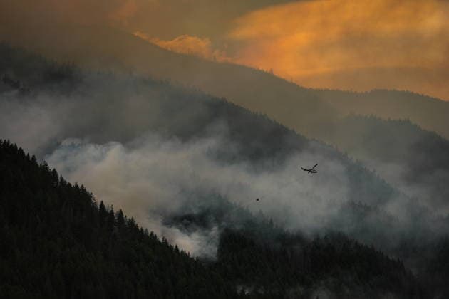 July 9, 2026, Boston Bar, Bc, CANADA: A helicopter turns to pick up more water while fighting the Brunswick Creek wildfire in Boston Bar, B.C., on Thursday, July 9, 2026. Boston Bar CANADA  - ZUMAc35_ 20260709_zaf_c35_075 Copyright: xDarrylxDyckx