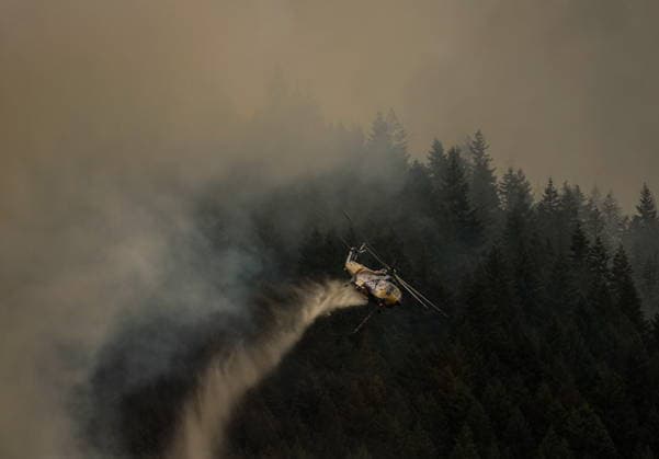 July 9, 2026, Boston Bar, Bc, CANADA: A helicopter drops water while fighting the Brunswick Creek wildfire in Boston Bar, B.C., on Thursday, July 9, 2026. Boston Bar CANADA  - ZUMAc35_ 20260709_zaf_c35_090 Copyright: xDarrylxDyckx