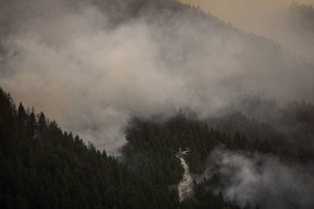July 9, 2026, Boston Bar, Bc, CANADA: A helicopter drops water while fighting the Brunswick Creek wildfire in Boston Bar, B.C., on Thursday, July 9, 2026. Boston Bar CANADA  - ZUMAc35_ 20260709_zaf_c35_087 Copyright: xDarrylxDyckx