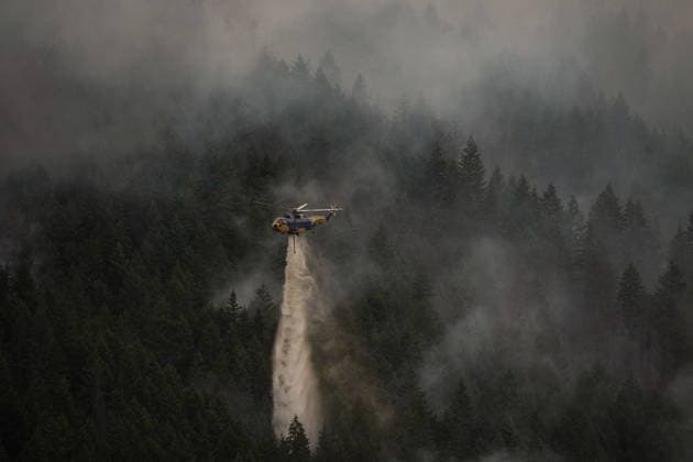 July 9, 2026, Boston Bar, Bc, CANADA: A helicopter drops water while fighting the Brunswick Creek wildfire in Boston Bar, B.C., on Thursday, July 9, 2026. Boston Bar CANADA  - ZUMAc35_ 20260709_zaf_c35_089 Copyright: xDarrylxDyckx