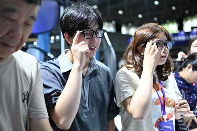 2026 AI Terminal Industry Expo NANJING, CHINA - JULY 10, 2026 - Visitors experience smart glasses at the Qwen AI Glasses booth at the 2026 Artificial Intelligence Terminal Industry Expo in Nanjing, Jiangsu Province, China on July 10, 2026. Nanjing Jiangsu China  Copyright: xCFOTOx i1783688702427