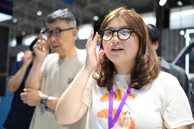 2026 AI Terminal Industry Expo NANJING, CHINA - JULY 10, 2026 - Visitors experience smart glasses at the Qwen AI Glasses booth at the 2026 Artificial Intelligence Terminal Industry Expo in Nanjing, Jiangsu Province, China on July 10, 2026. Nanjing Jiangsu China  Copyright: xCFOTOx i1783688702586