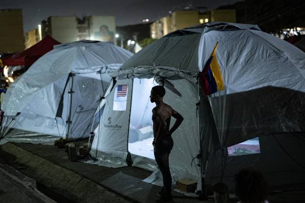 Earthquake survivors continue living in temporary shelters in La Guaira LA GUAIRA, VENEZUELA - JULY 10: A boy stands outside temporary shelters in La Guaira, Venezuela, on July 10, 2026. Residents continue to stay in tents after the powerful 7.2 and 7.5 magnitude earthquakes that struck Venezuela in succession on June 24 caused widespread destruction in the coastal city, forcing thousands of people to leave their homes. Cem Tekkesinoglu Anadolu La Guaira Venezuela. Editorial use only. Please get in touch for any other usage.  Copyright: x2026xAnadoluxCemxTekkesinoglux